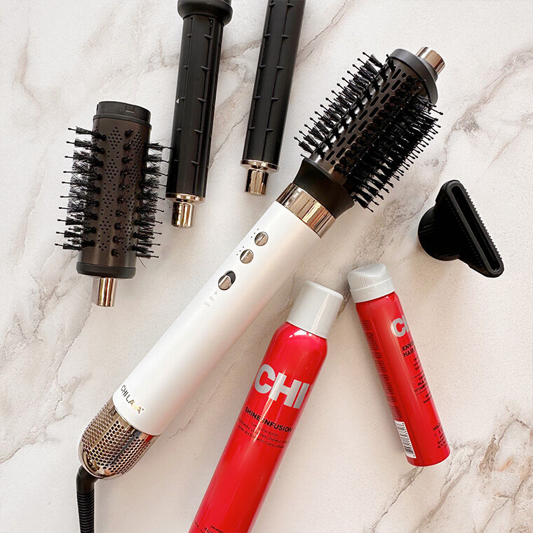Lava Air Glam Multi Styler and products on marble countertop