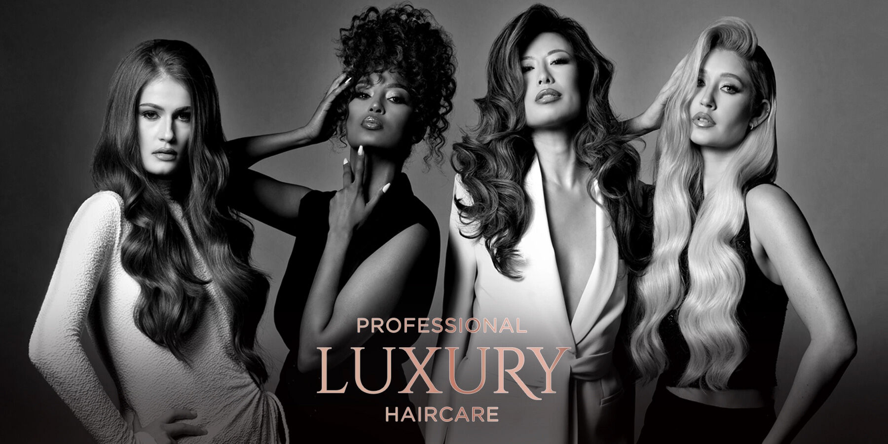 Black-and-white image of four women with different luxurious hairstyles. The text reads "Professional Luxury Haircare".